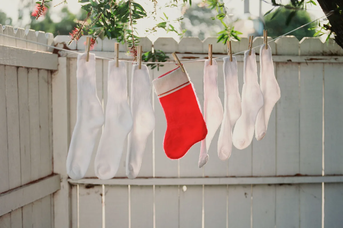 Christmas stocking with other socks on Clothesline