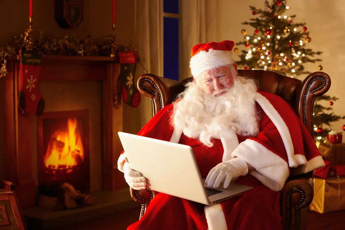 Santa working on a laptop computer