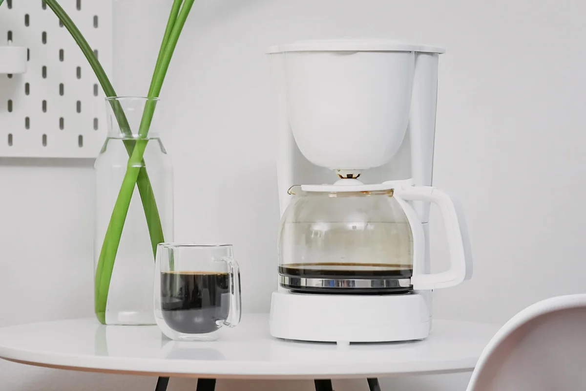 Coffee machine and coffee cup in office room