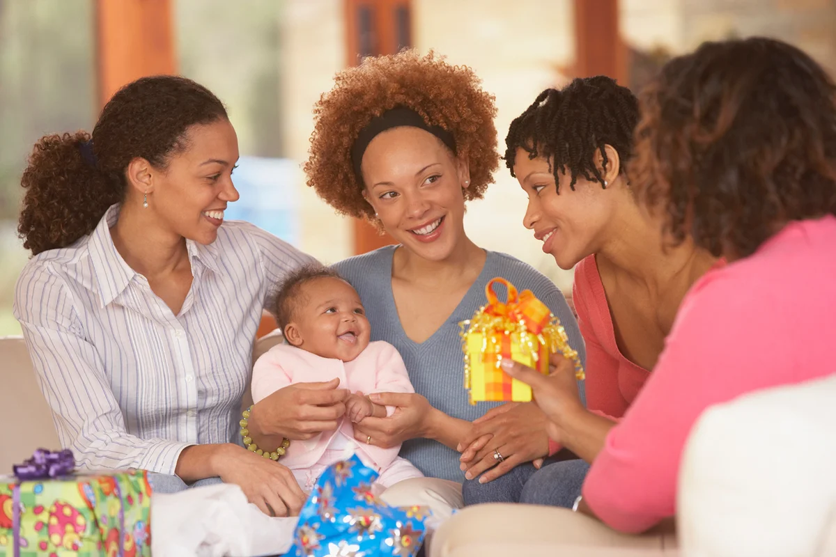 Mother and baby with friends at baby shower