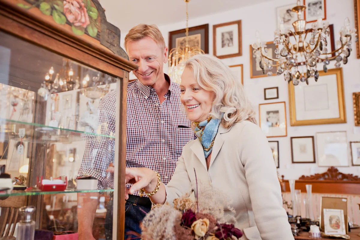 Senior woman shopping in an antiquity store