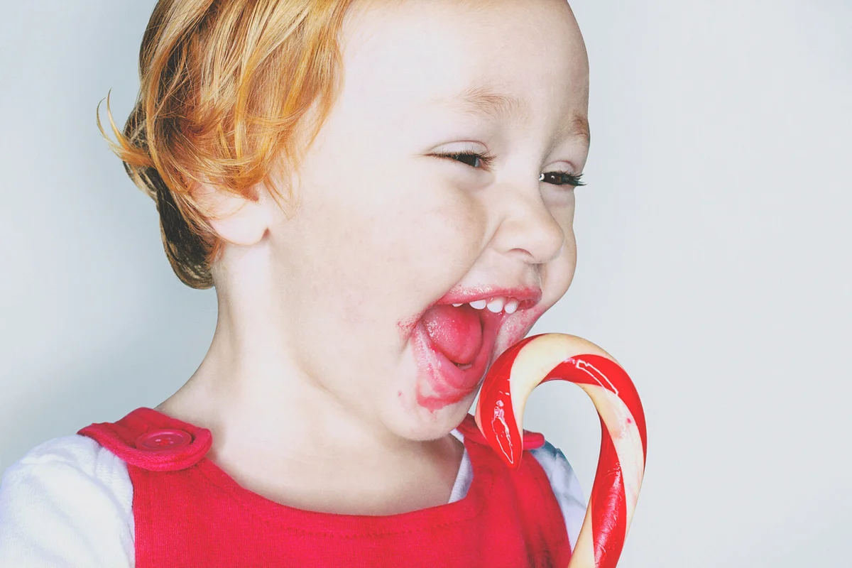 Girl eating candy cane