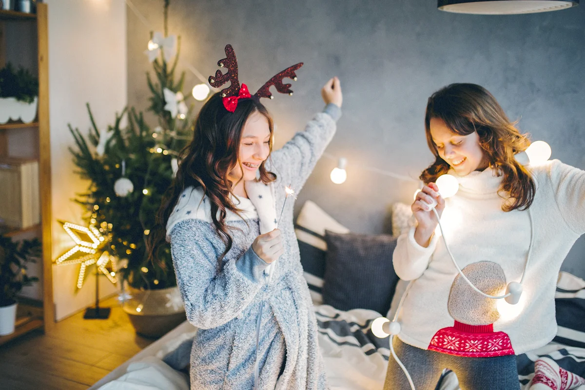 Teen girls listening to music on Christmas