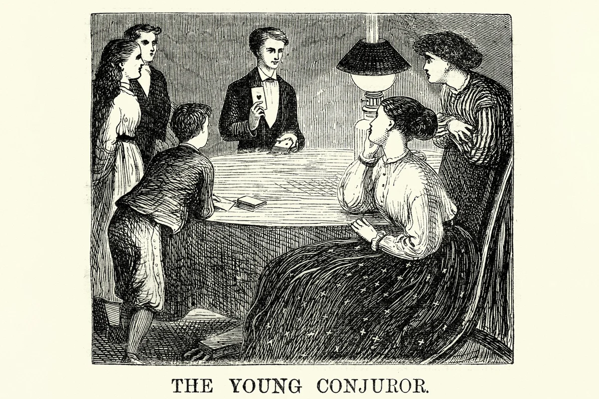 Victorian boy doing a card trick