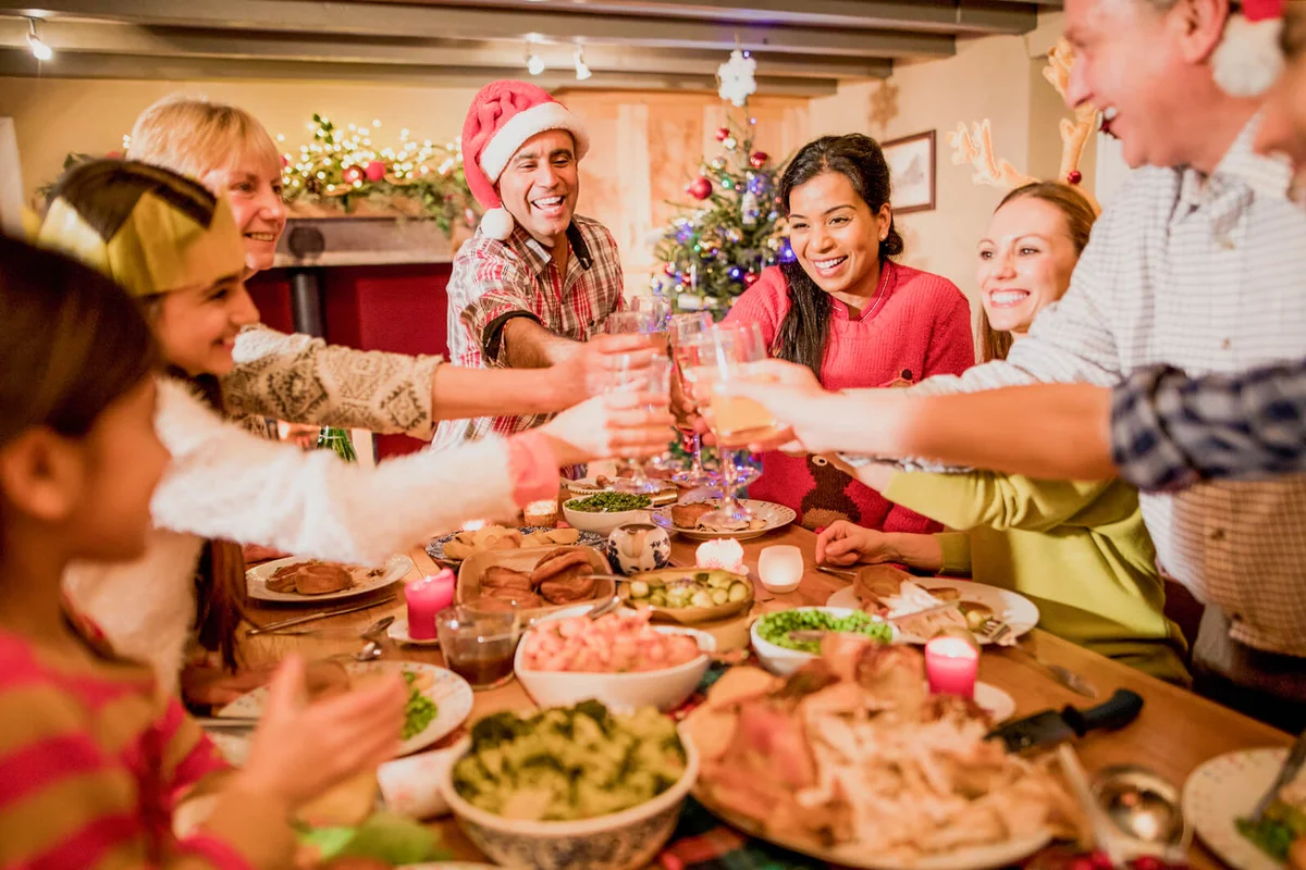 A family toast and celebrate at Christmas dinner