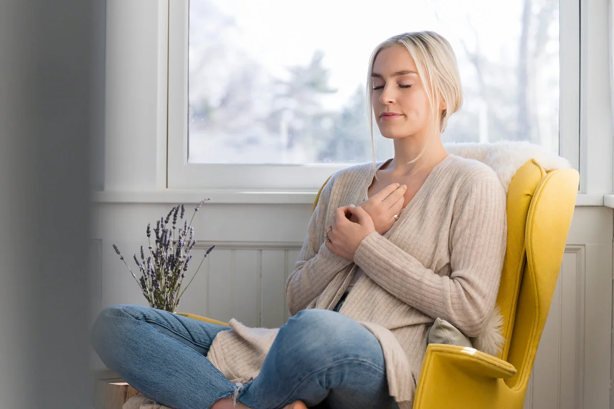 Woman meditating at home