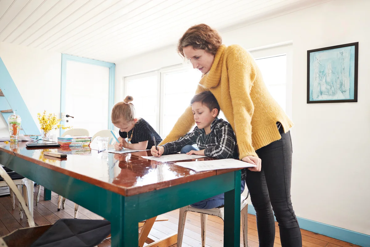 Mother homeschooling her kids