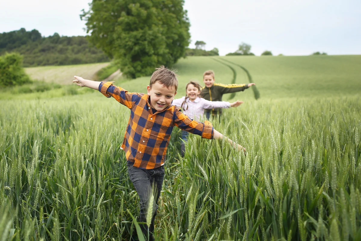 Children running in a field