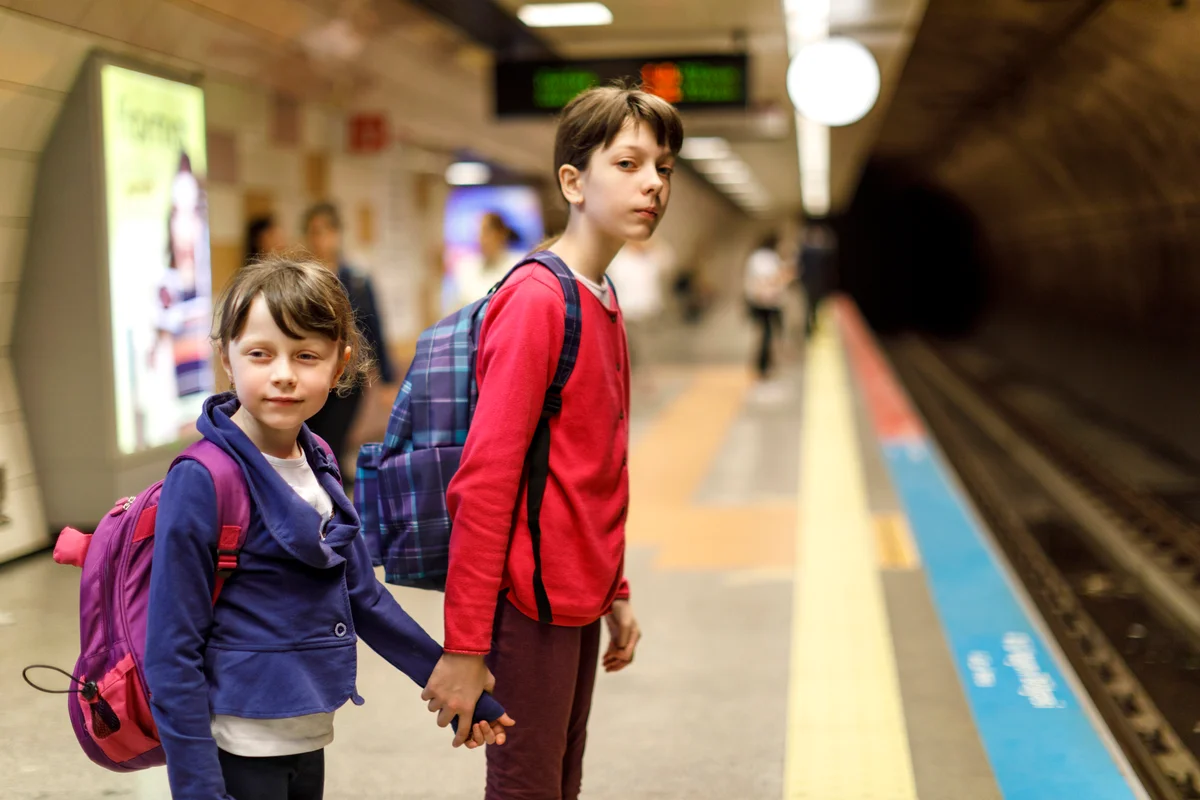Kids waiting in the railway station