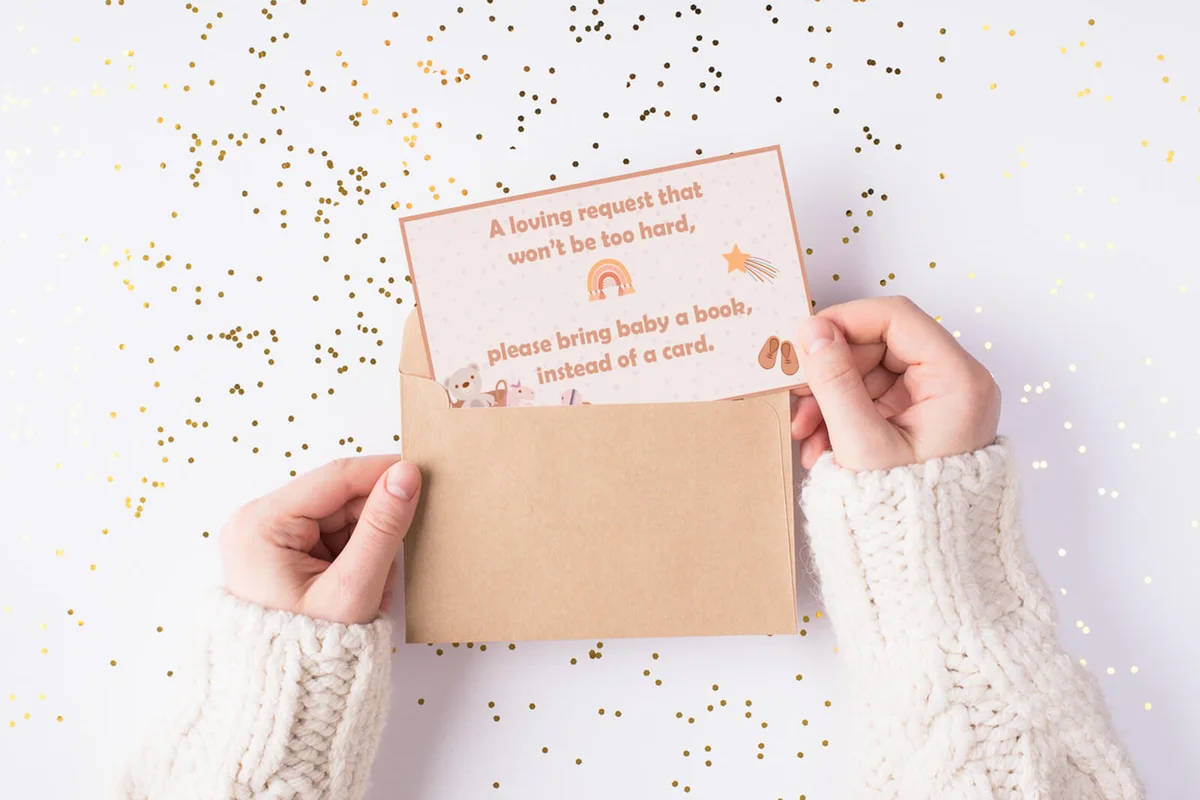 female hands holding kraft paper envelope with mock up copy space card