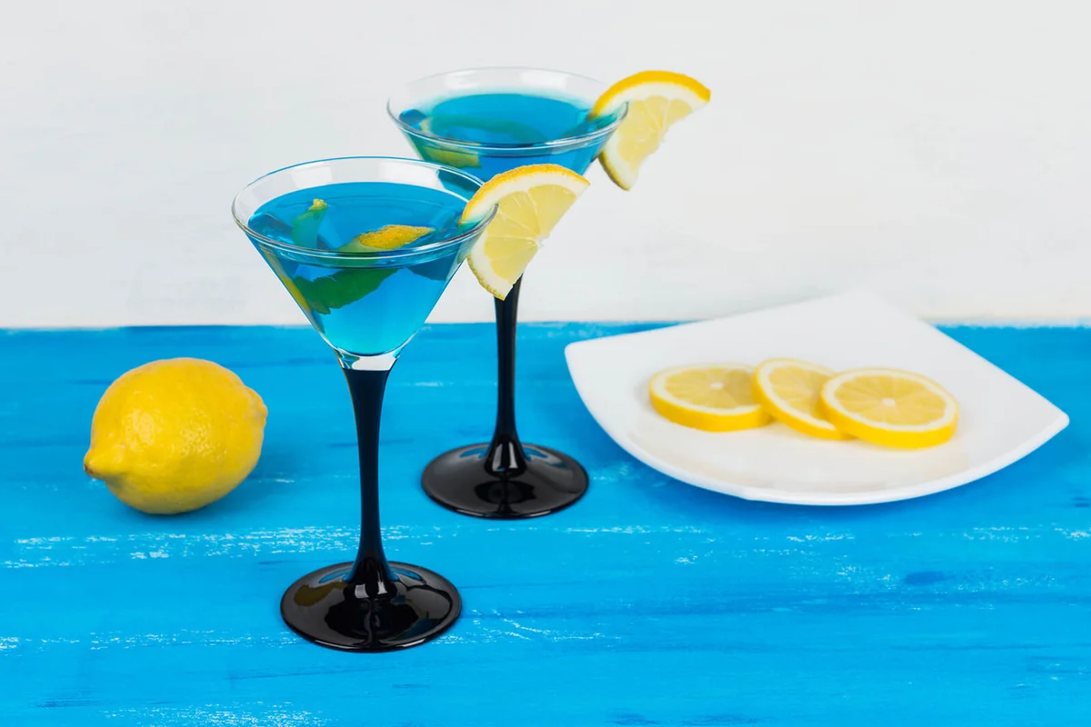 Blue cocktail on the wooden table