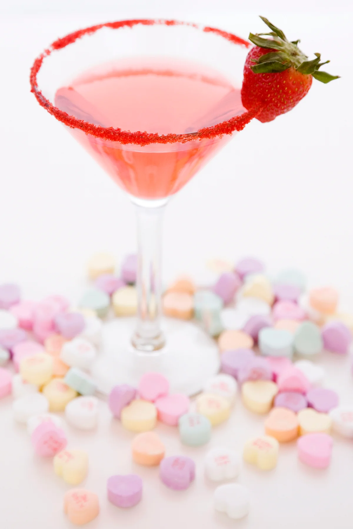 Cocktail surrounded by candy hearts