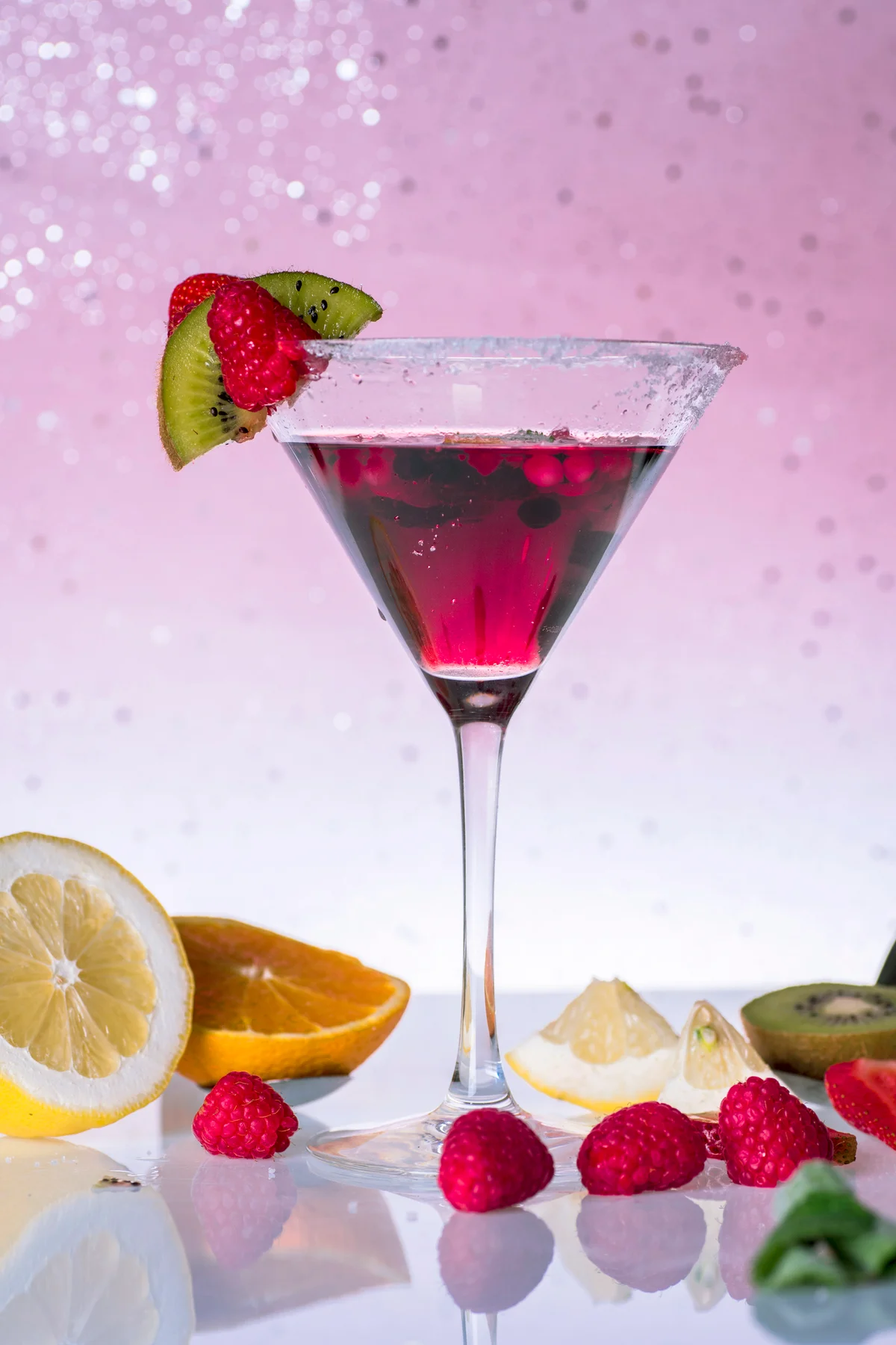 Fruit cocktail with sugar and salt, garnished with pieces of fresh fruit