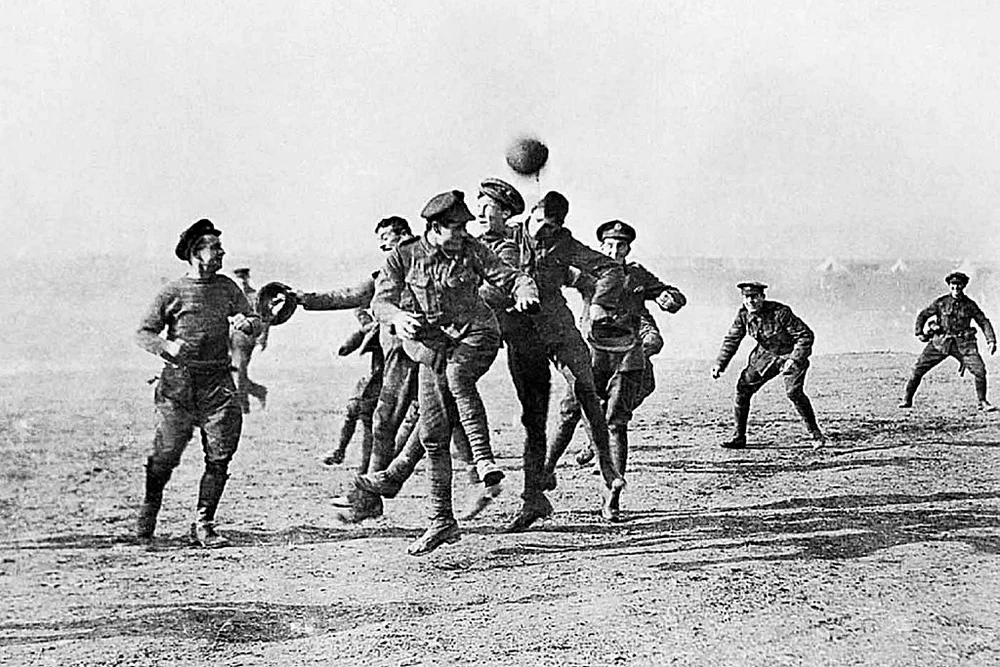 Soldiers playing football in No-Man's Land