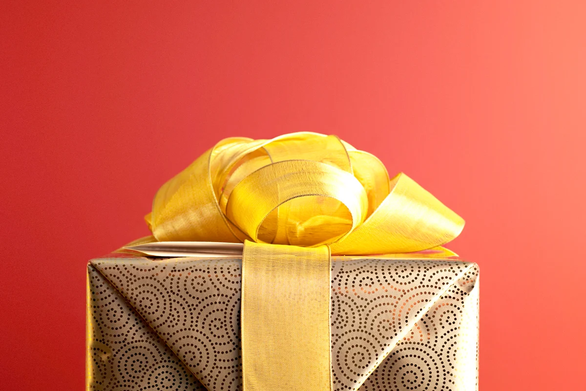 Christmas gift with gold ribbon
