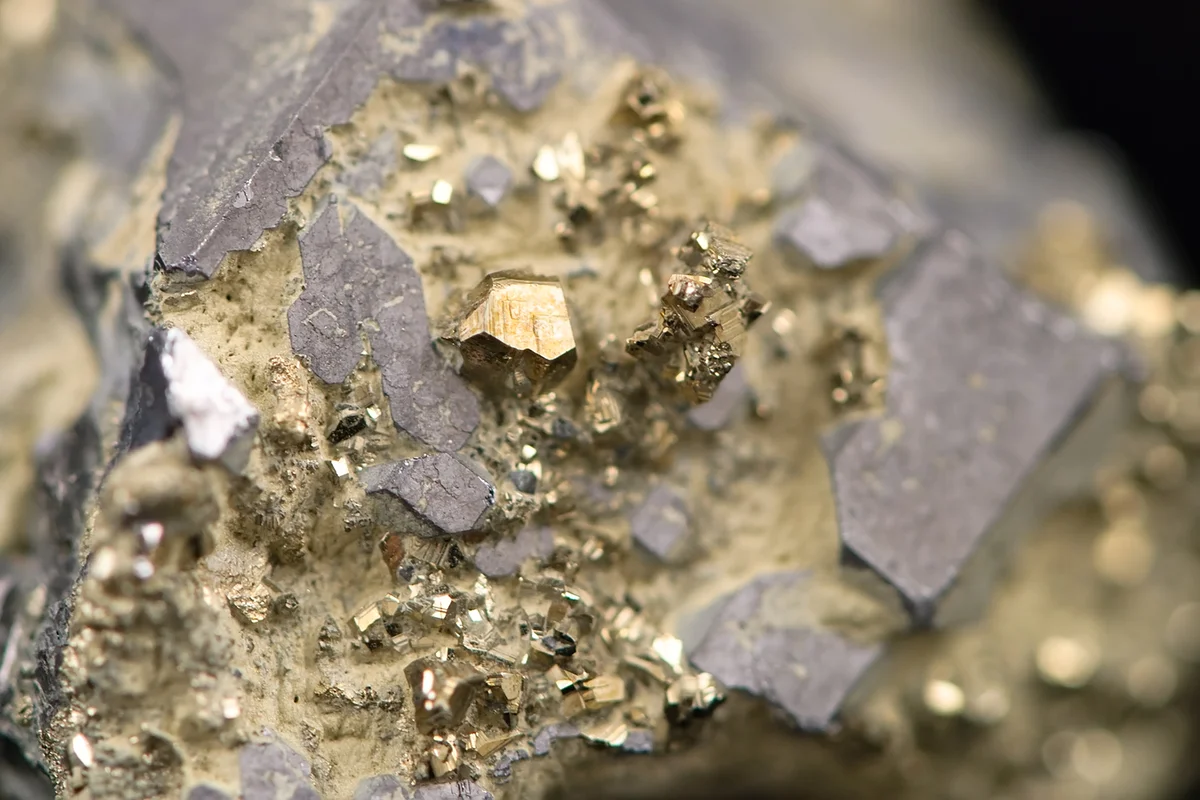 Macro picture of a raw golden nugget found on a mine
