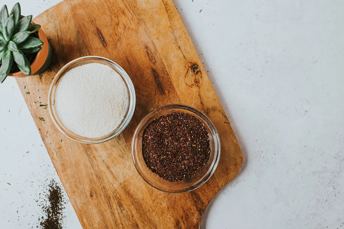 Top down image of Organic White Sugar and a Rosehip and Hibiscus Blend in Glass Bowls