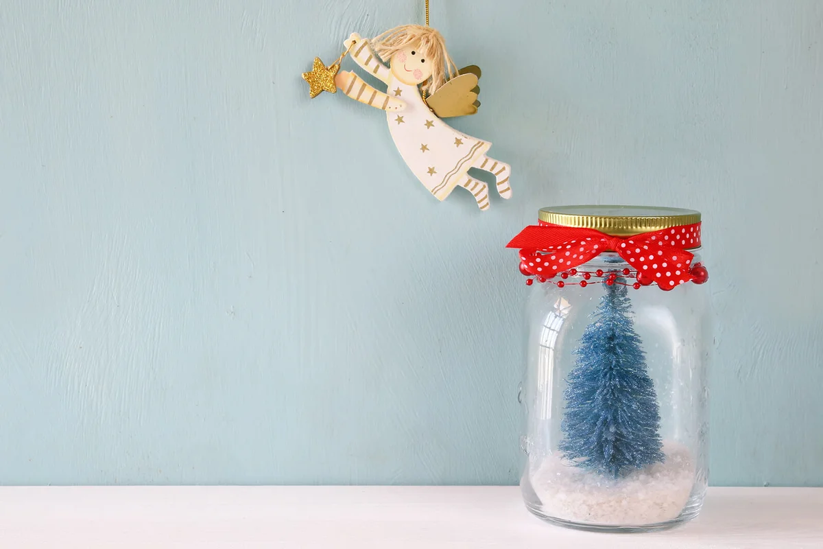 beautiful mason jar with christmas tree and flying angel