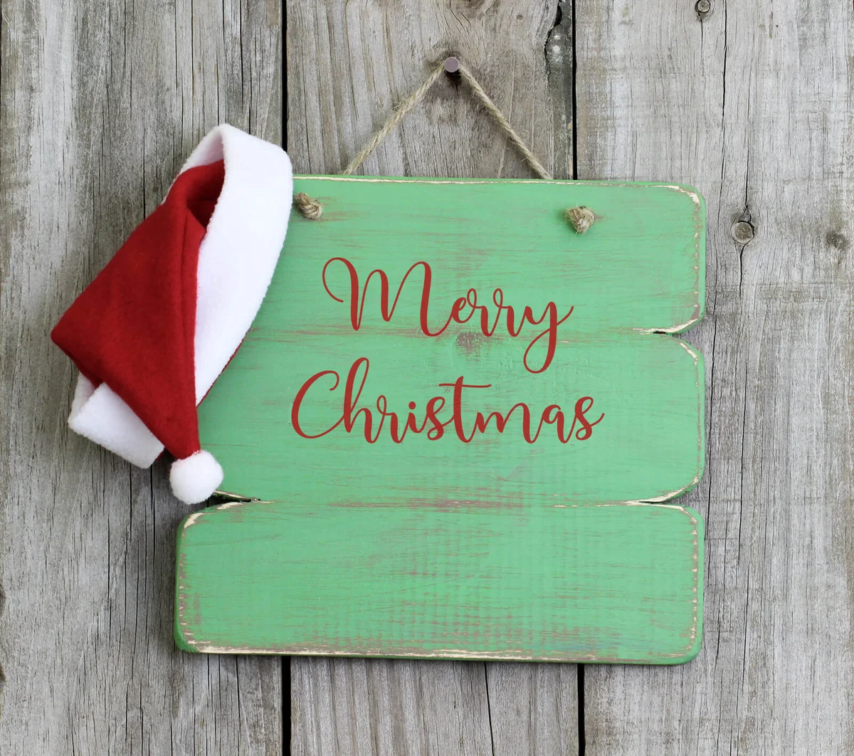 sign with Santa Claus hat