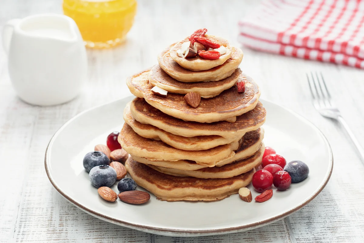 Stack of oat pancakes with berries
