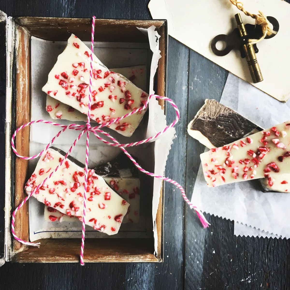 Overhead view of peppermint bark in box on table