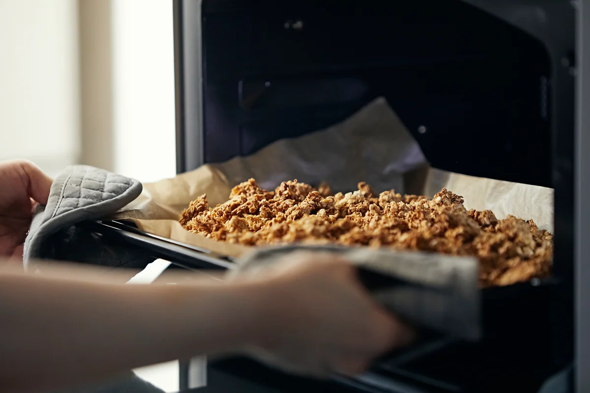 Take the homemade granola out of the oven
