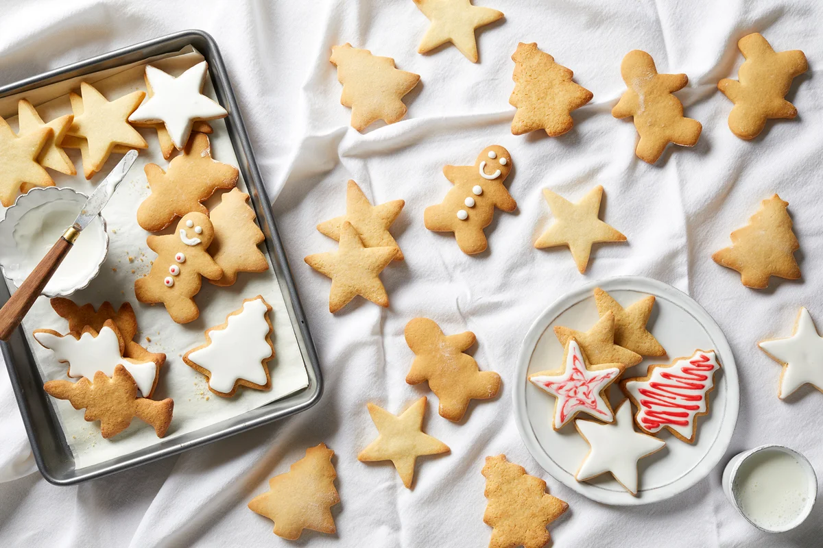 Christmas sugar cookies being iced