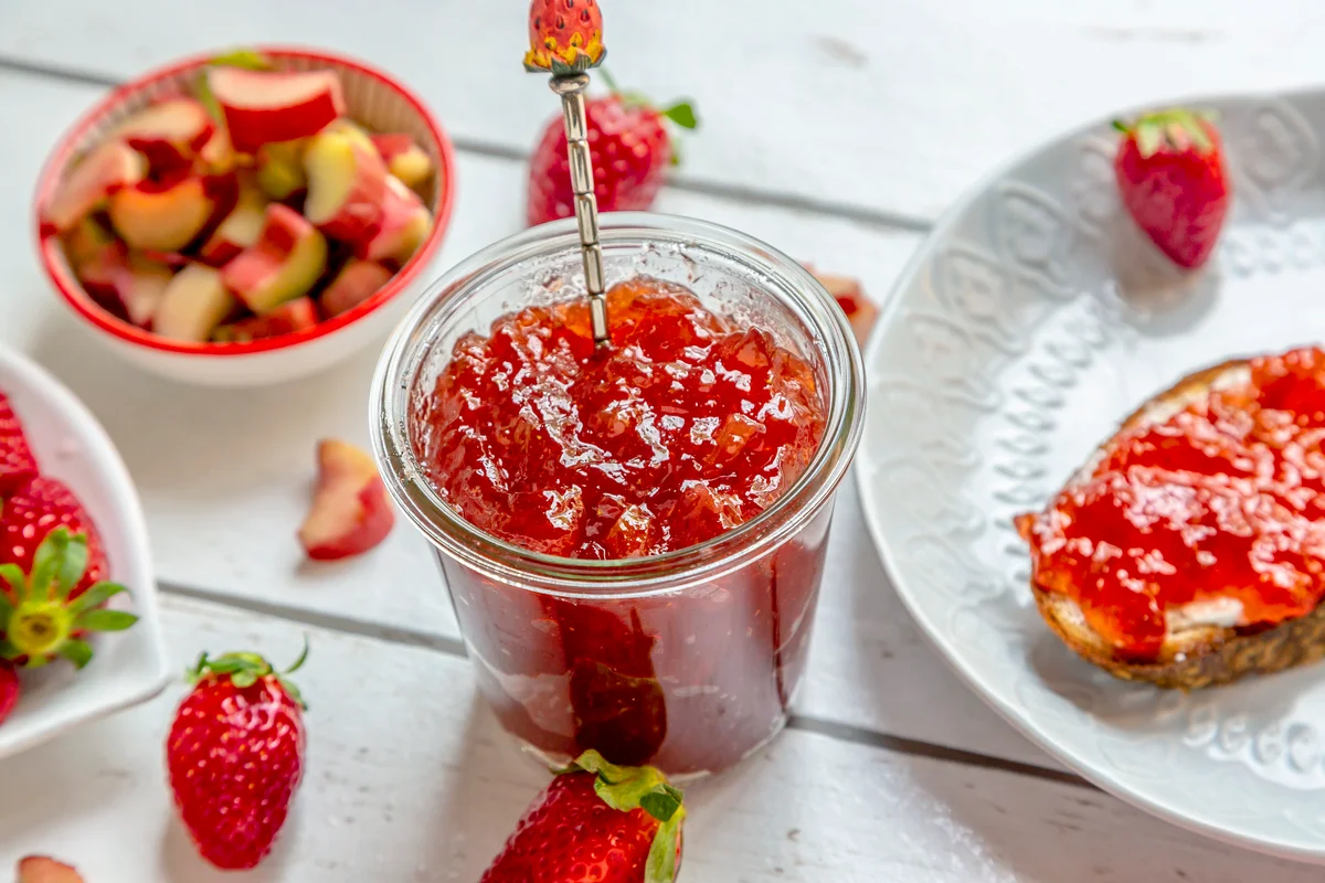 Jar of jelly with toasts and strawberries
