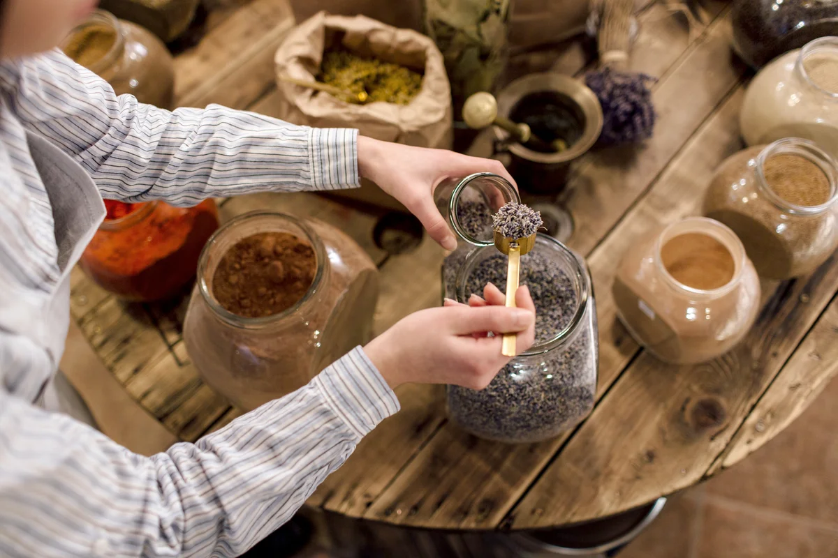 Woman Preparing Spice Mix in Jar