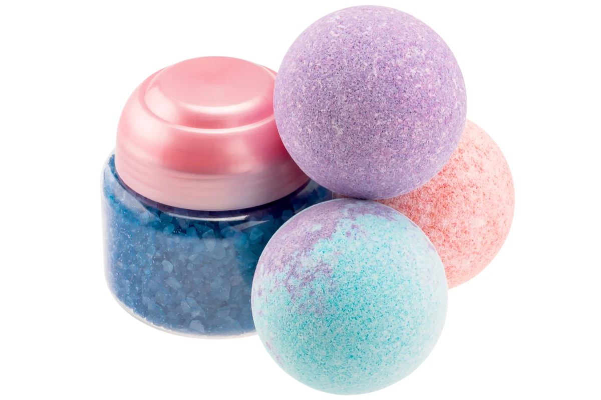 Bath bombs and bottle with blue sea salt