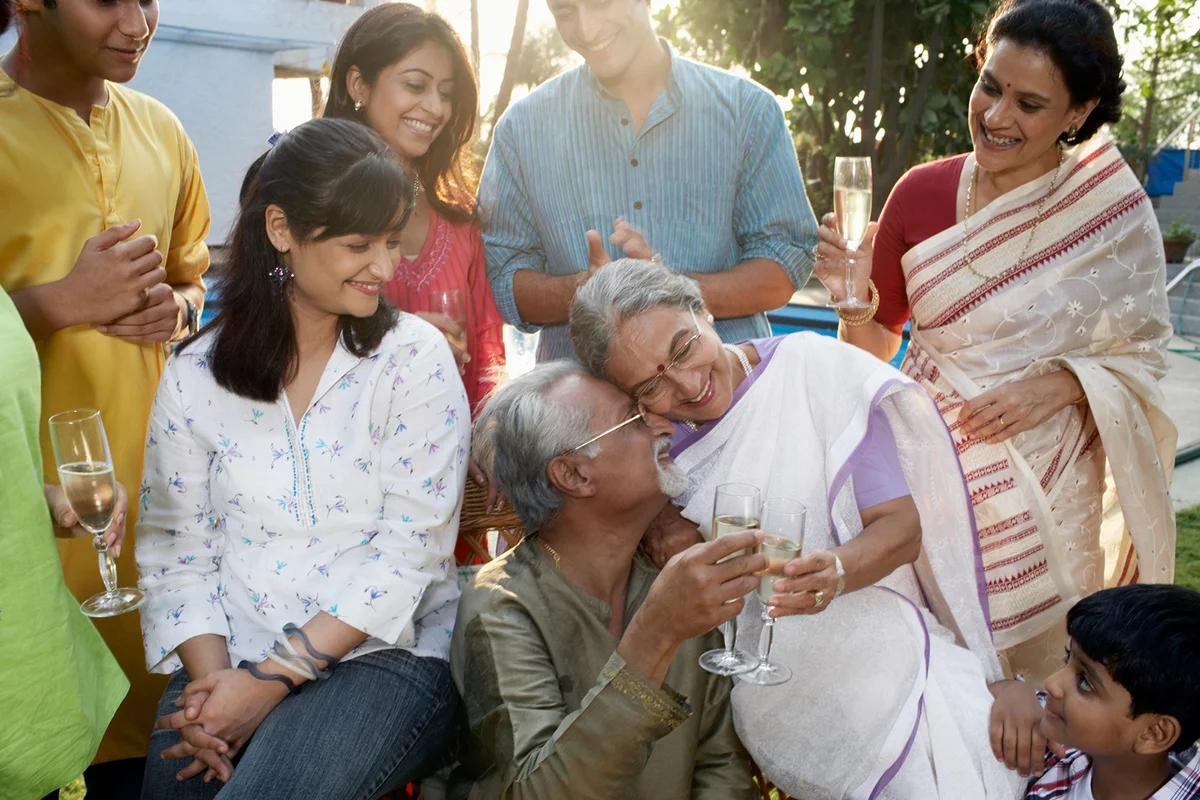 Family celebration, grandparents with heads together