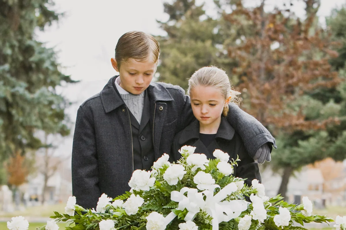 brother and sister at a funeral
