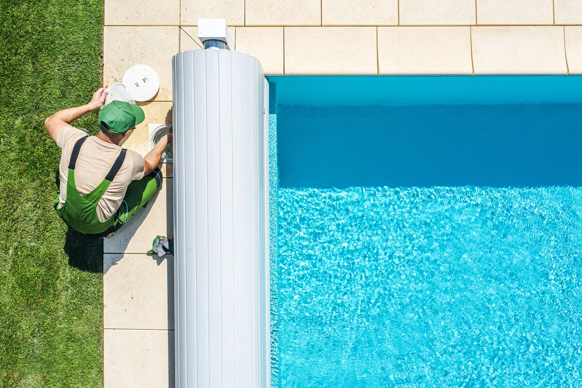 Man working on swimming pool