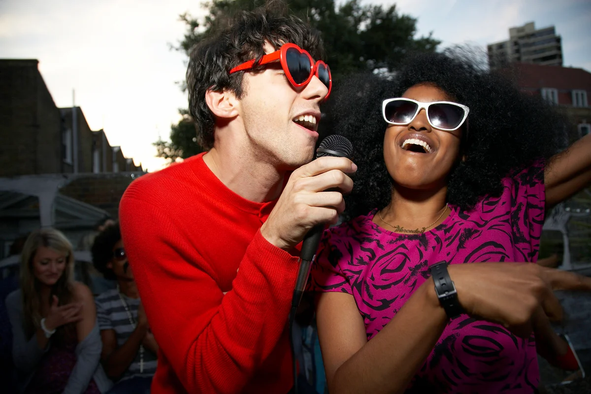 Couple doing karaoke