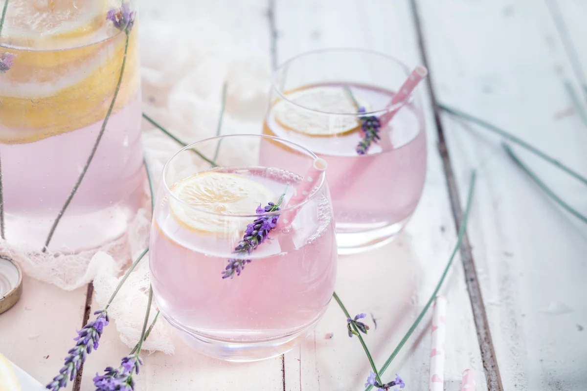 Lemon lavender gin in glass with drinking straw