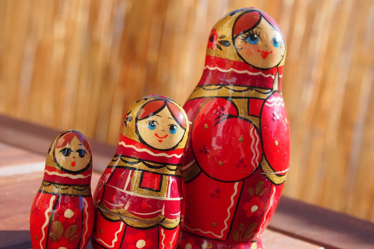 Red Matryoshka Dolls On Table
