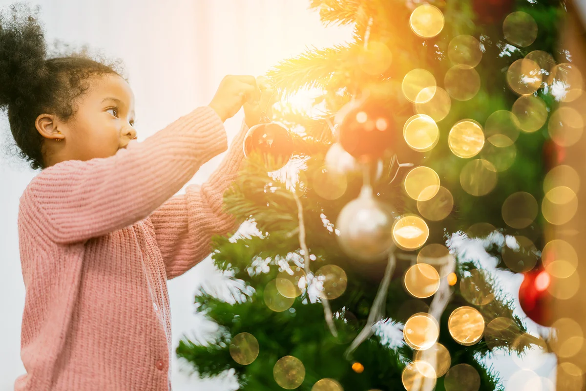Kid arrange decorate christmas tree