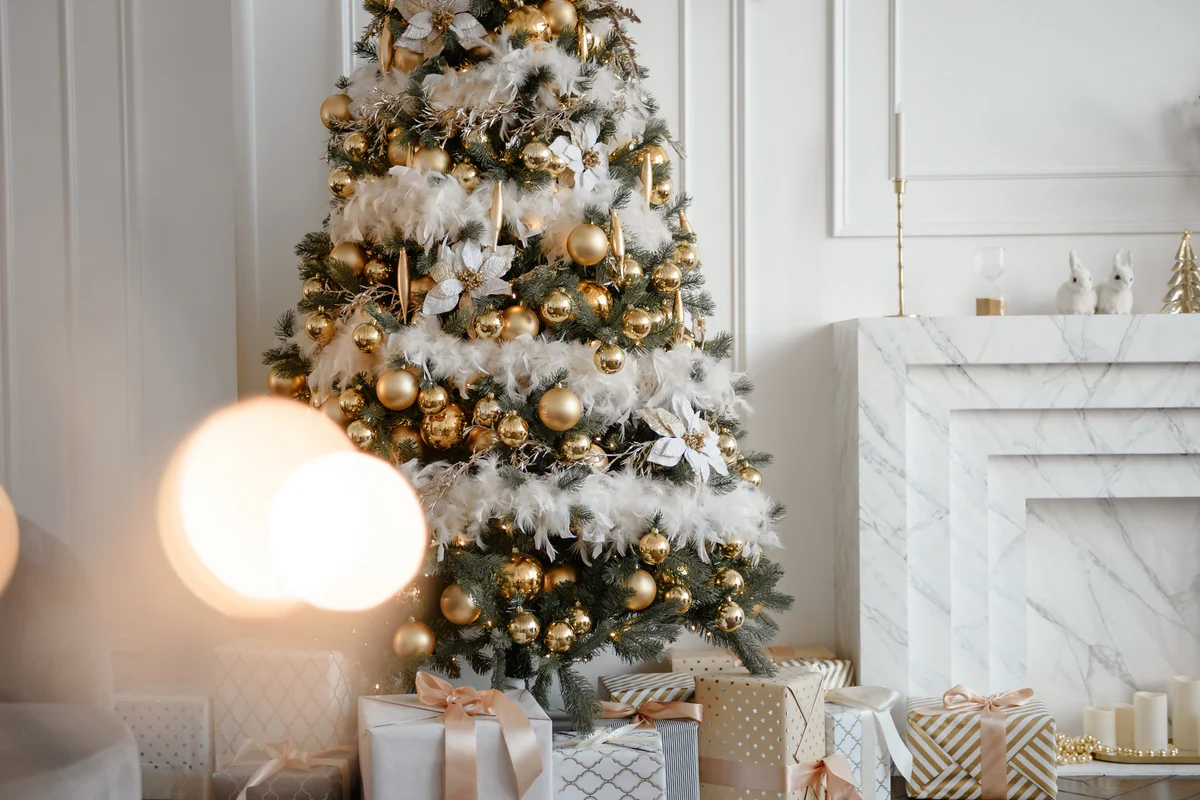Stylish Christmas living room decor in gold and silver tones.