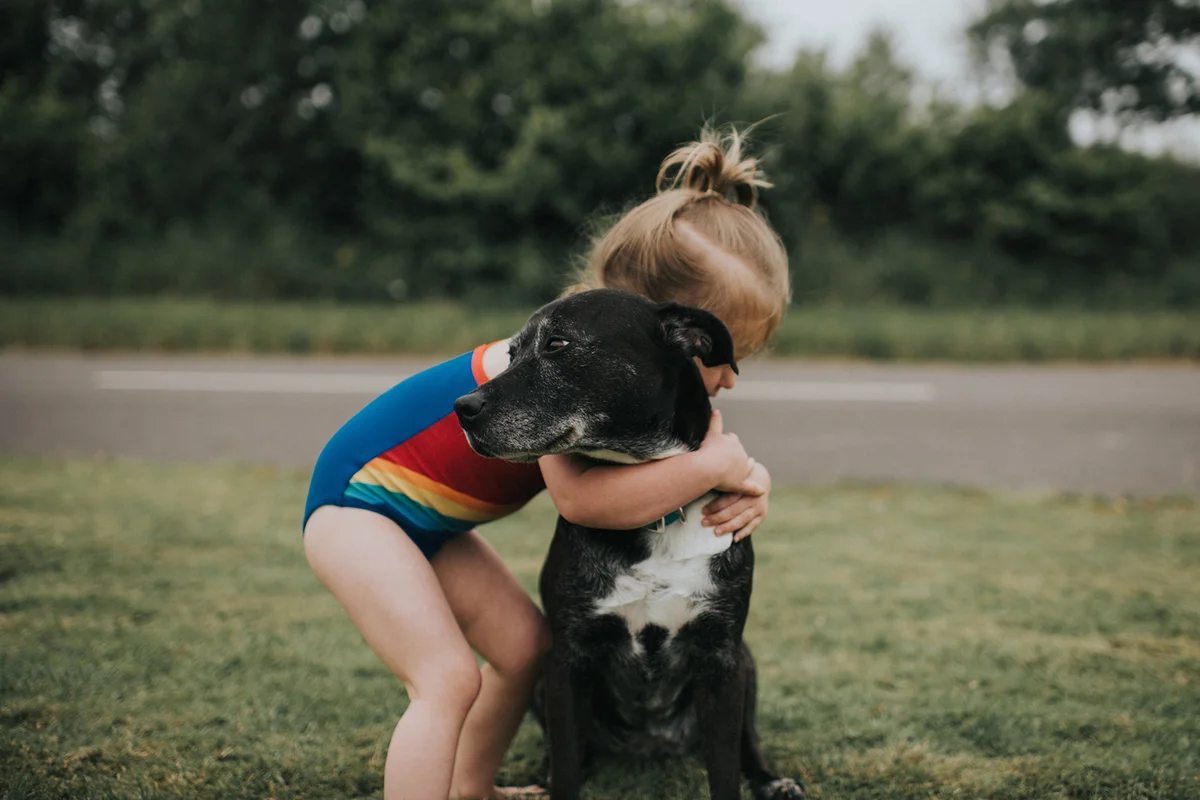 Girl hugs Dog