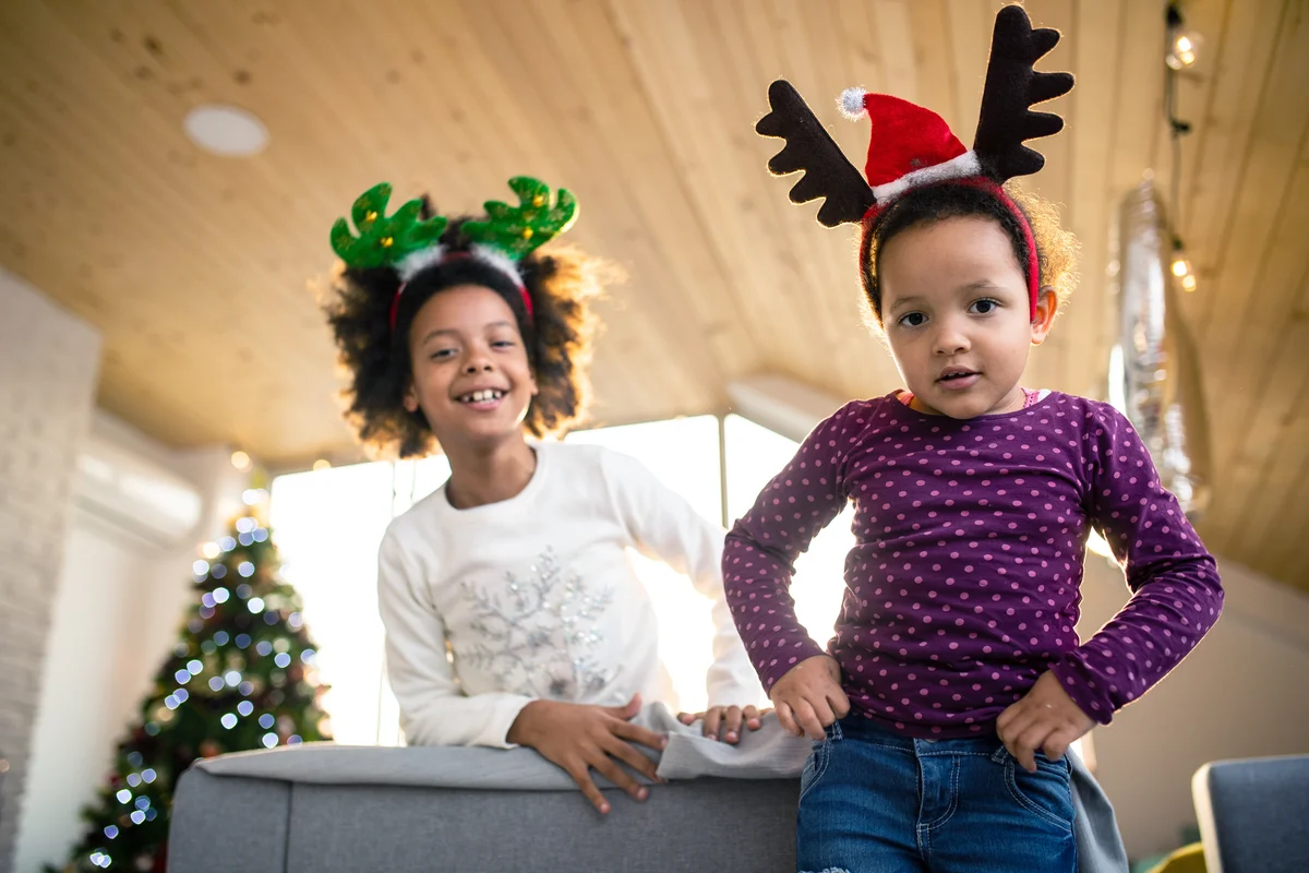 Cute sisters acting like reindeers