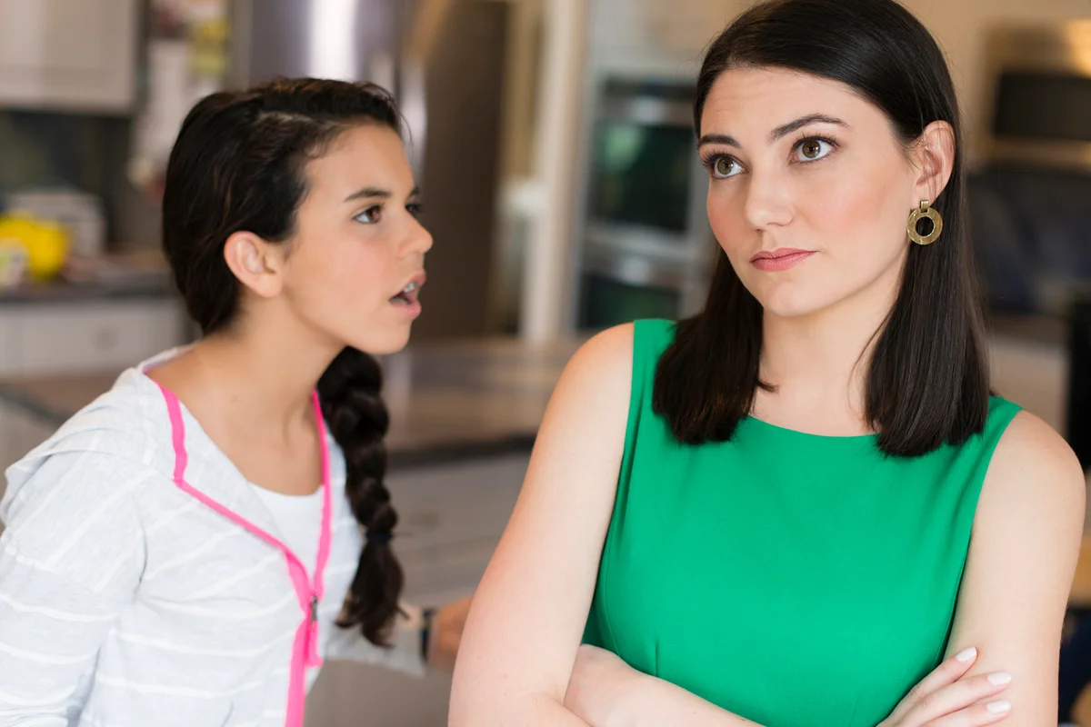 Mother and daughter arguing in kitchen