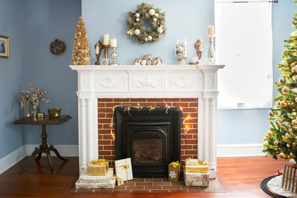 Christmas tree by fireplace with decoration