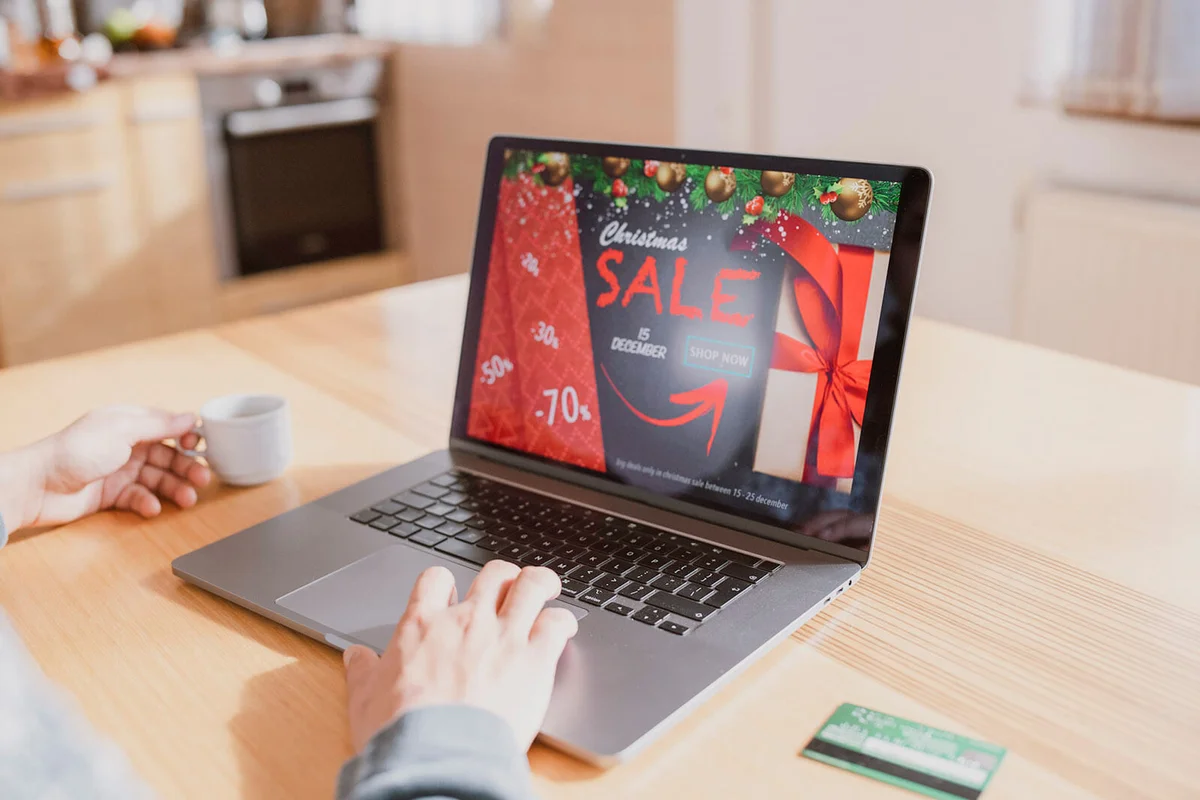 Woman shopping online at Christmas sale
