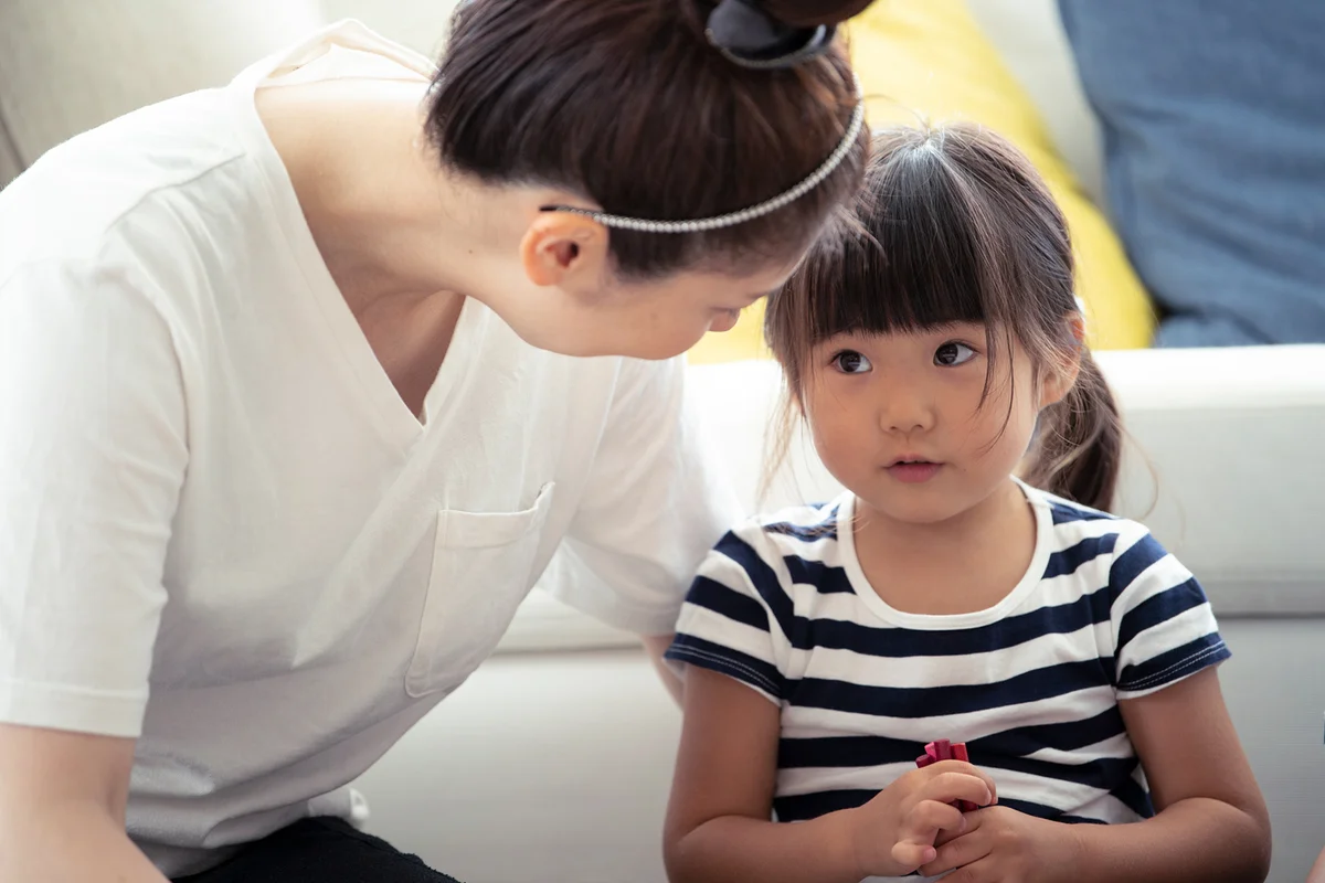 Mother and daughter are looking at each other