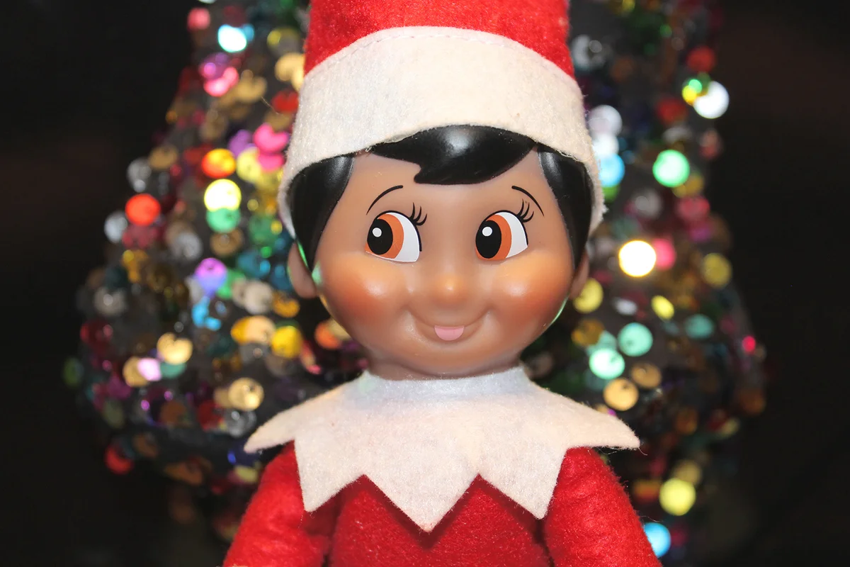 Elf with Christmas decoration background