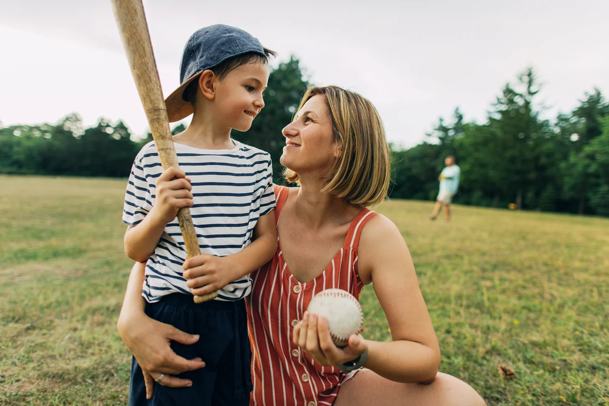 Mom cheering little baseball player