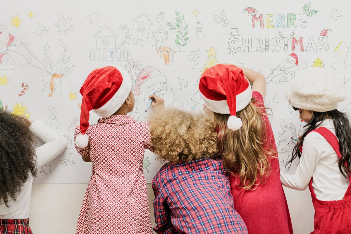 Kids drawing on a Christmas decoration