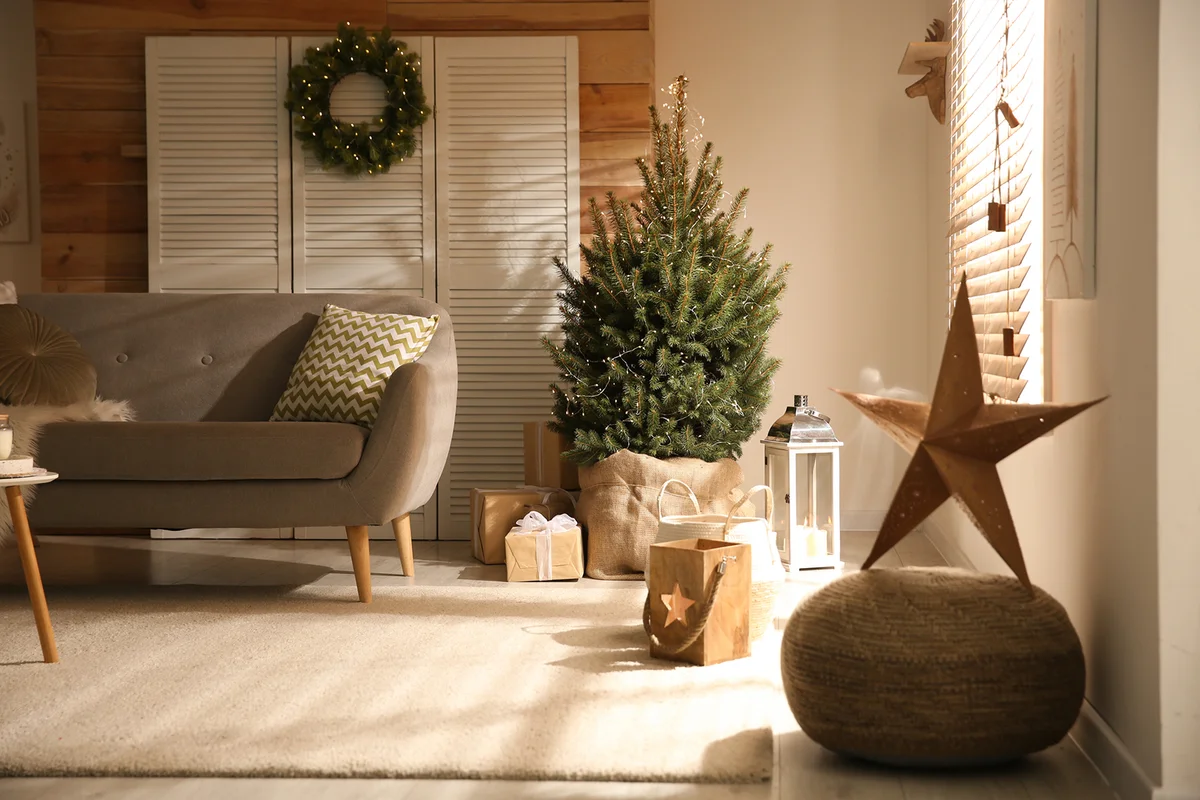Spacious room interior with small Christmas tree