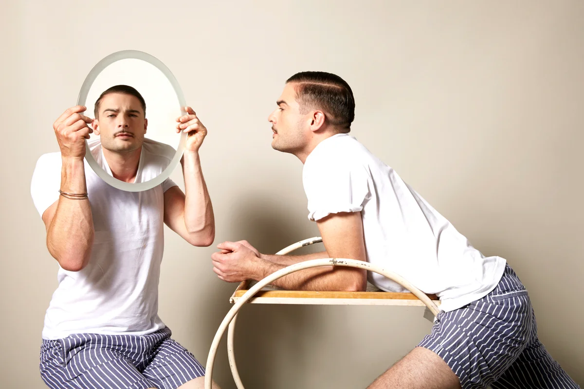 Man looking at himself in the mirror