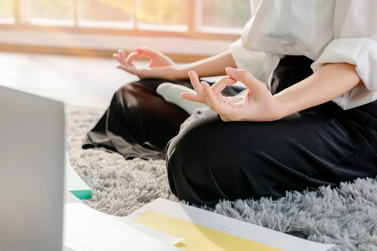 Woman working at home with a notebook Relaxing by meditating